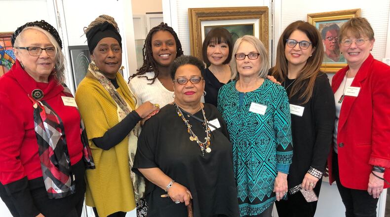 Members of Women Strong, whose work is included in current exhibit at main branch of the Dayton Public Library downtown, from left: Yvette Dalton, Audrey Davis, Cydnie King, Frances Turner, Yufeng Wang, Janet Lasley, Nasrin Majidi, and Marsha Pippenger. Not pictured are Erin Smith-Glenn, Diana Barr and Lois Fortson-Kirk.