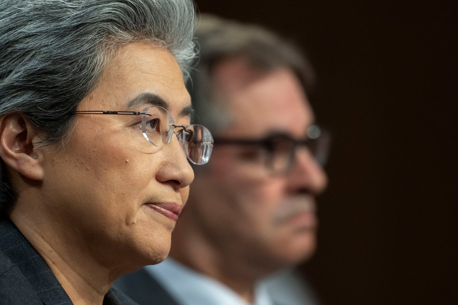 Dr. Lisa Su, chief executive officer and chair, Advanced Micro Devices (AMD), left, and Michael Intrator, co-founder and chief executive officer, CoreWeave, take part in a hearing before the Senate Committee on Commerce, Science, and Transportation, Thursday, May 8, 2025, in Washington. (AP Photo/Kevin Wolf)
