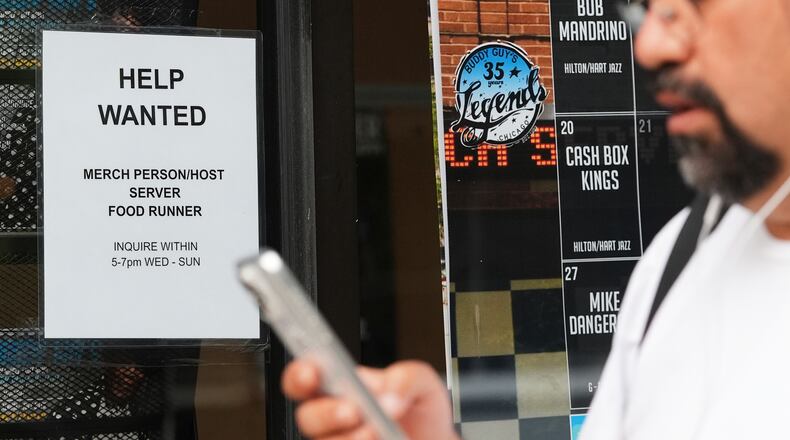 Help wanted sign is displayed at a live music and blues club in Chicago, Thursday, July 24, 2025. (AP Photo/Nam Y. Huh)