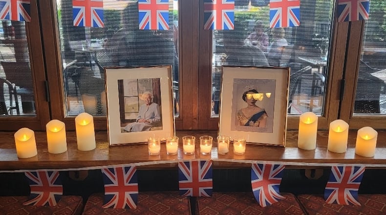 The Pub at The Greene in Beavercreek added a space for patrons to pay their respects to Queen Elizabeth II during the 10 days of mourning. CONTRIBUTED