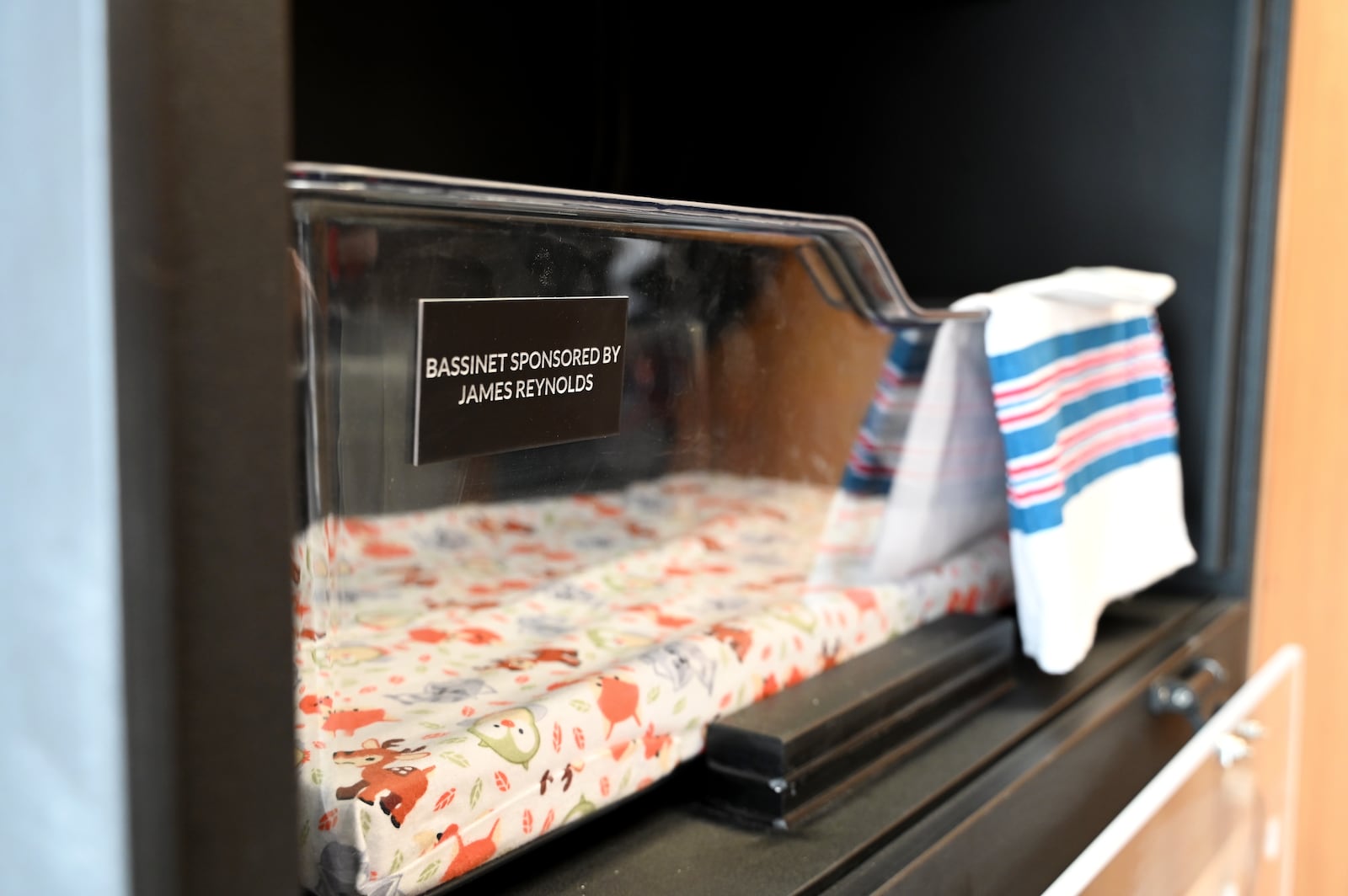 Hamilton dedicated Butler County's first Safe Haven Baby Box on Tuesday afternoon, Nov. 11, 2025, at the Fire Station 22 on Pershing Avenue. The box is designed to allow mothers to anonymously place a newborn baby 30 days or younger in the incubator. Fire personnel are notified through a silent alarm. Mothers can still surrender a baby at any hospital, fire department or police station under Ohio's Safe Haven law. Pictured is the interior of the box were firefighters and paramedics have access to the baby. MICHAEL D. PITMAN/STAFF