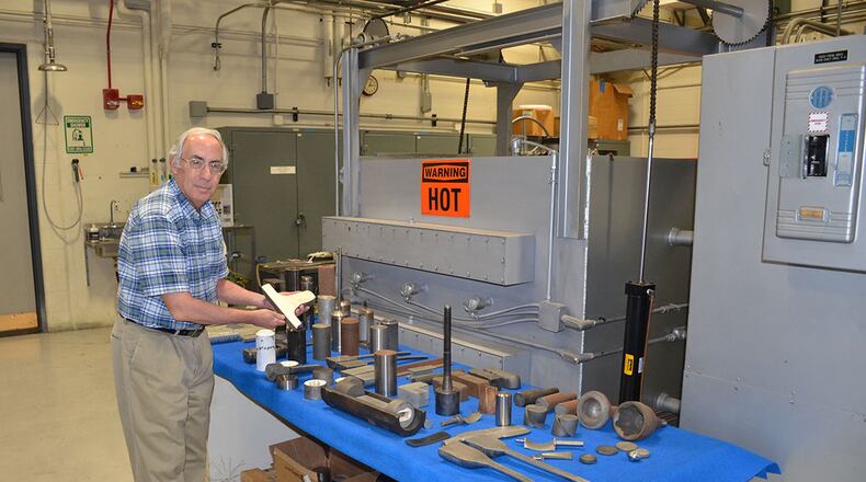 The Air Force Research Laboratory’s Dr. Sheldon (Lee) Semiatin handles metal samples in the Experimental Materials Processing Laboratory. It serves as both a state-of-the-art laboratory for basic and applied research as well as a test bed for new materials and processes developed in conjunction with partners in the Air Force supply chain. (U.S. Air Force photo/Donna Lindner).