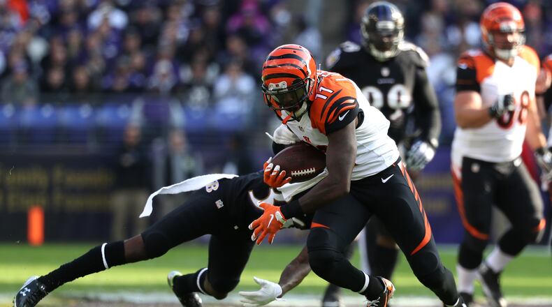 BALTIMORE, MD - NOVEMBER 27: Wide receiver Brandon LaFell #11 of the Cincinnati Bengals carries the ball past cornerback Tavon Young #36 of the Baltimore Ravens in the first quarter at M&T Bank Stadium on November 27, 2016 in Baltimore, Maryland. (Photo by Rob Carr/Getty Images)