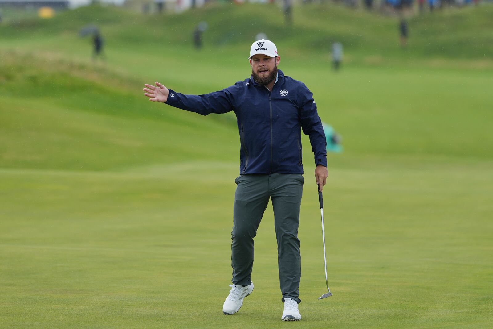 Tyrrell Hatton of England gestures after putting on the 10th green during the first round of the British Open golf championship at the Royal Portrush Golf Club, Northern Ireland, Thursday, July 17, 2025. (AP Photo/Jon Super)
