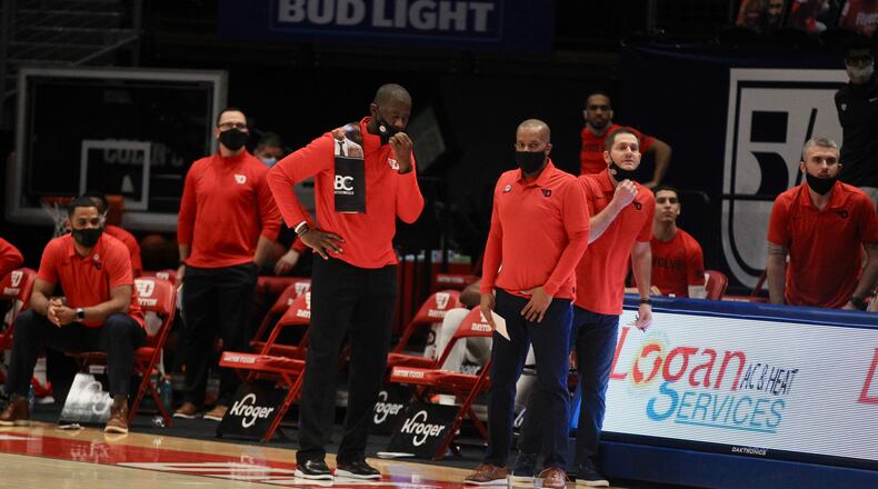 Dayton's Anthony Grant talks to his assistants during a game against Saint Louis on Friday, Feb. 19, 2021, at UD Arena. David Jablonski/Staff