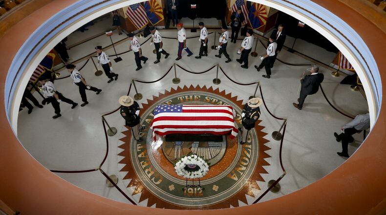 PHOENIX, AZ - AUGUST 29: Veterans walk past the casket of Sen. John McCain, R-Ariz. during a memorial service at the Arizona Capitol on August 29, 2018 in Phoenix, Arizona. Sen. McCain, a decorated war hero, died August 25 at the age of 81 after a long battle with Glioblastoma, a form of brain cancer. (Photo by Ross D. Franklin-Pool via Getty Images) *** BESTPIX ***