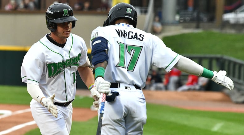 John Michael Faile is greeted by Alexander Vargas after hitting a solo homer in the second inning Wednesday night at Day Air Ballpark. JEFF GILBERT/CONTRIBUTED