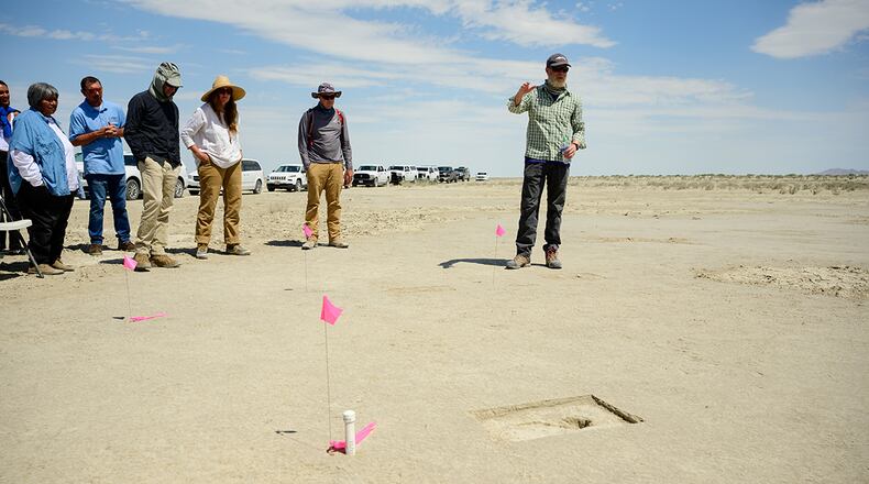 Daron Duke, Far Western Anthropological Research Group, speaks with visitors to an archaeological site on the Utah Test and Training Range on July 18. In compliance with Section 106 of the National Historic Preservation Act, the Air Force works closely with the Utah State Historic Preservation Office to explore, discover and preserve historical and cultural artifacts on the UTTR. U.S. AIR FORCE PHOTO/R. NIAL BRADSHAW