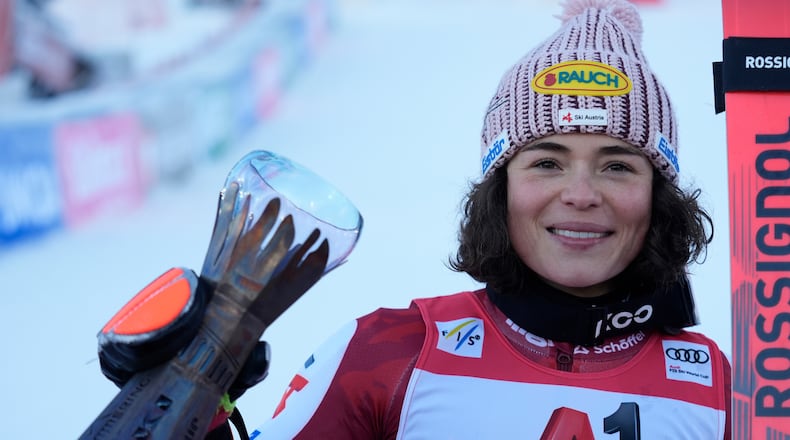 Austria's Julia Scheib celebrates winning an alpine ski, women's World Cup giant slalom, in Semmering, Austria, Saturday, Dec. 27, 2025. (AP Photo/Giovanni Auletta)