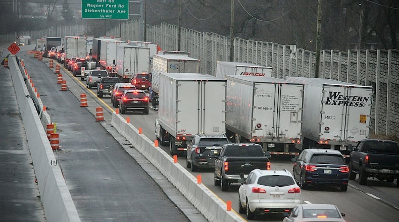 Traffic was backed up on Interstate 75 South in Dayton on Friday, Jan. 26, 2024, after the highway was closed near Stanley Avenue for pothole repairs. MARSHALL GORBY \STAFF
