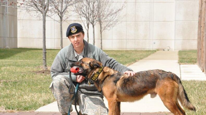 Staff Sgt.AshleyAlbright, 88th Security Forces military working dog trainer, awards her dog with a toy after a bite demonstration. New dog handlers are trained on additional real-world scenarios to further their skills.