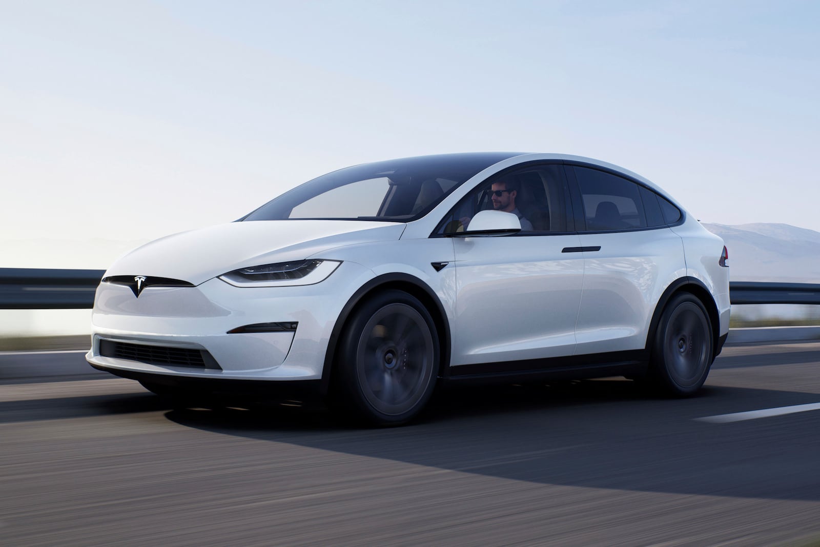 This photo provided by Tesla shows the 2022 Model X, a three-row electric SUV famous for its falcon-wing doors and available used at bargain prices. (Courtesy of Tesla via AP)