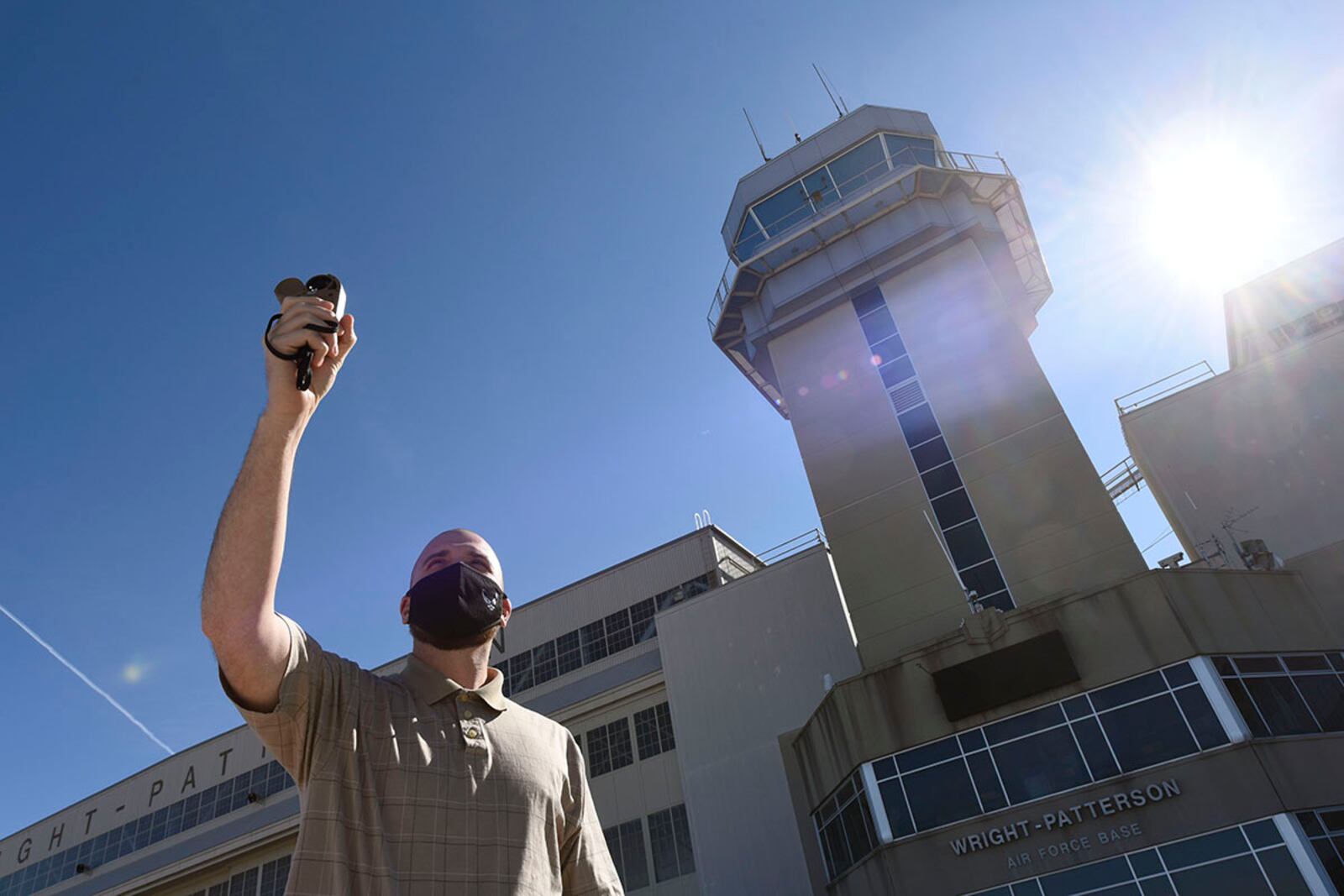 Air Force contractors Ryan Balding (left) and Zach Grandin, 88th Operations Support Squadron weather technicians, discuss past storm systems in the Wright-Patterson Air Force Base weather station March 2. Ten contractors operate the weather station around the clock, supporting the aviation mission with briefs, observations and forecasts. The team also protects resources through watches, warnings and advisories. U.S. AIR FORCE PHOTO/TY GREENLEES