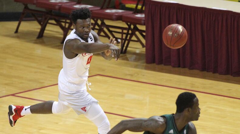 Dayton’s Jordan Davis passes against Ohio on Friday, Nov. 17, 2017, at TD Arena in Charleston, S.C. David Jablonski/Staff