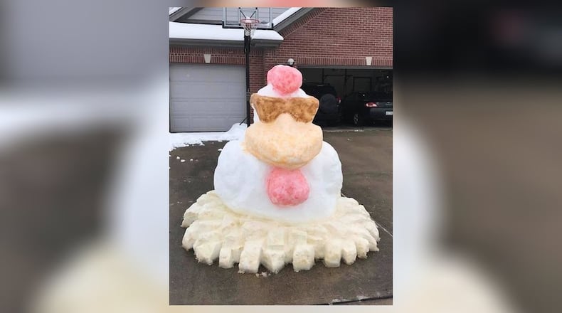 Kyla Bedel and Ken Bedel of Vandalia created this snow chicken after one of the snow storms that have came through this winter. CONTRIBUTED.
