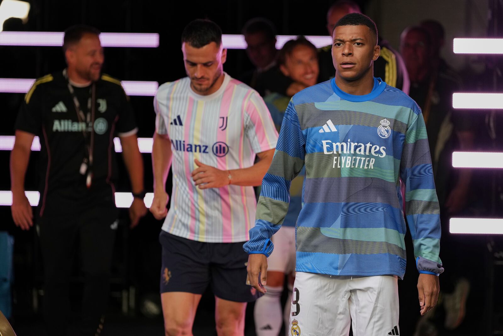 Real Madrid's Kylian Mbappe walks out to the pitch before the Club World Cup round of 16 soccer match between Real Madrid and Juventus in Miami Gardens, Fla., Tuesday, July 1, 2025. (AP Photo/Rebecca Blackwell)