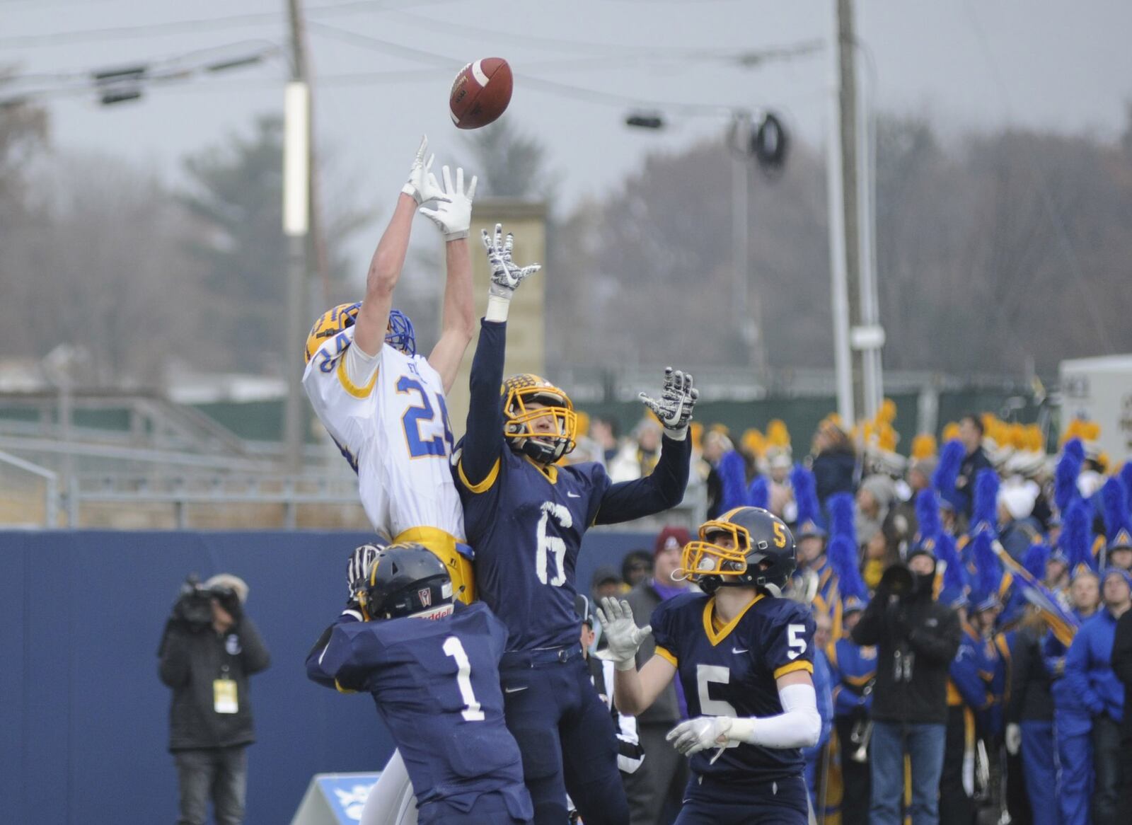 Marion Local’s Nick Tangeman (24) draws a crowd of Kirtland defenders. Kirtland defeated Marion Local 16-7 in the D-VI high school football state championship at Canton’s Tom Benson Hall of Fame Stadium on Friday, Nov. 30, 2018. MARC PENDLETON / STAFF