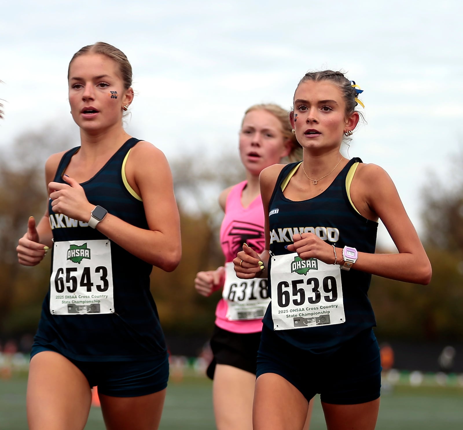 Oakwood seniors Delaney Cahill (6539) and Riley Meador (6543) compete at the 2025 OHSAA State Cross Country Championships, Sat. Nov. 1, 2025, at Fortress Obetz in Columbus. STEVEN WRIGHT / STAFF