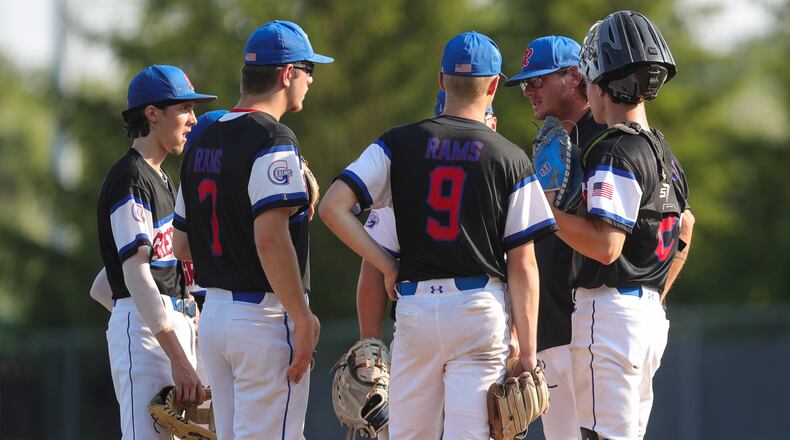 Greeneview baseball players meet on the mound during Friday's Division III regional final vs. Heath. Michael Cooper/CONTRIBUTED