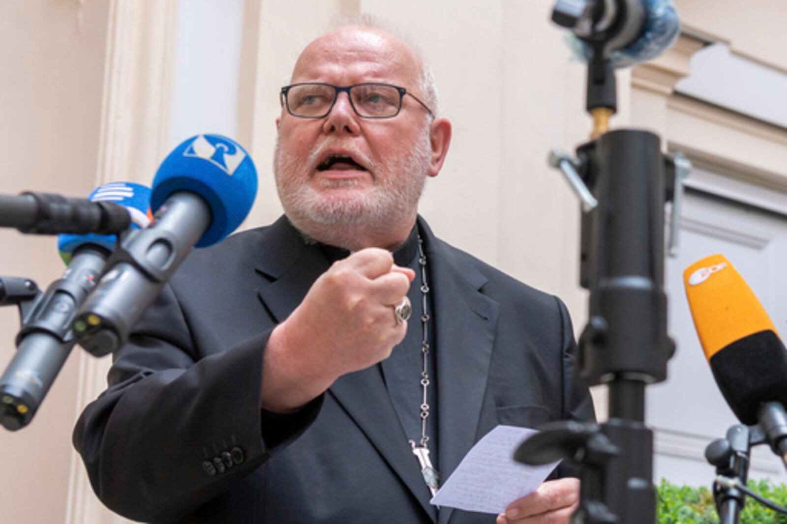FILE - Cardinal Reinhard Marx, Archbishop of Munich and Freising, gives a statement to the press in the courtyard of his residence in Munich, Friday, June 4, 2021. (Peter Kneffel/dpa via AP, File)