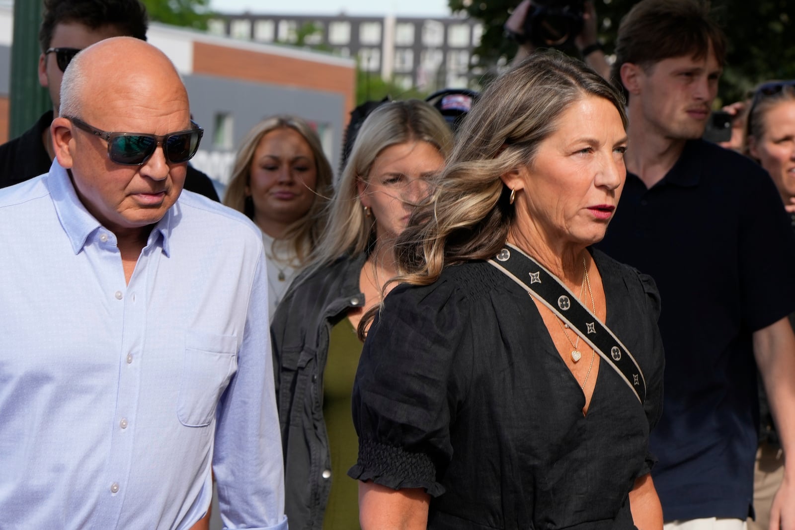 The family of Ethan Chapin including mother Stacy Chapin and father Jim Chapin walk to the Ada County Courthouse for Bryan Kohberger's plea deal hearing on Wednesday, July 2, 2025, in Boise, Idaho. (AP Photo/Jenny Kane)