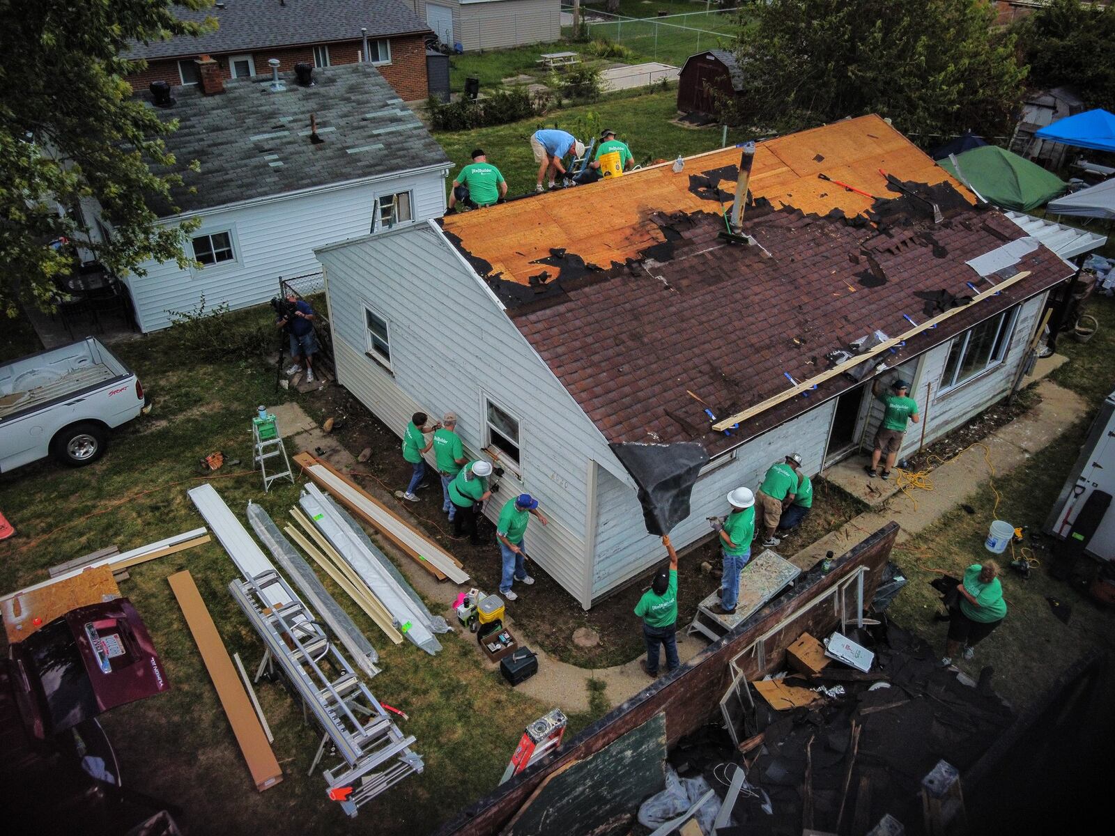 Tornado recovery was fast for some, and slow for others. Here, volunteers from Shiloh Church and corporate partners reroof a house on Oneida Avenue in Harrison Twp. in September 2021, more than two years after the Memorial Day tornados. JIM NOELKER/STAFF