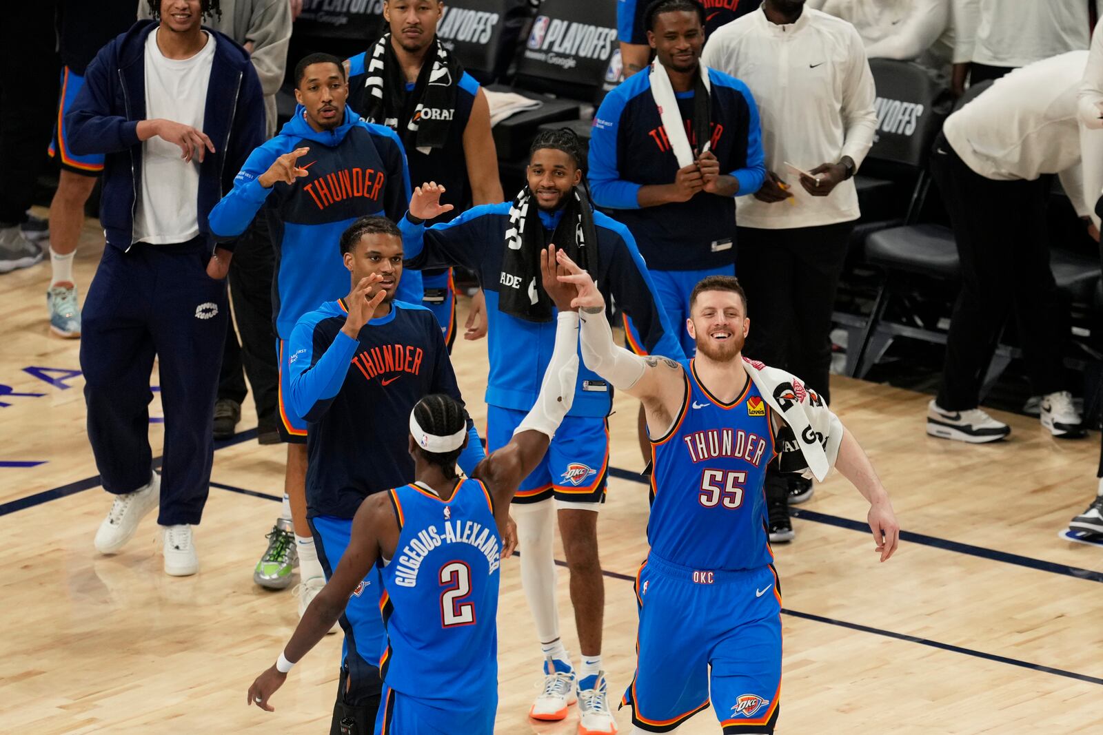 Oklahoma City Thunder center Isaiah Hartenstein (55) celebrates with guard Shai Gilgeous-Alexander (2) during the second half in Game 4 of an NBA basketball first-round playoff series against the Memphis Grizzlies, Saturday, April 26, 2025, in Memphis, Tenn. (AP Photo/George Walker IV)