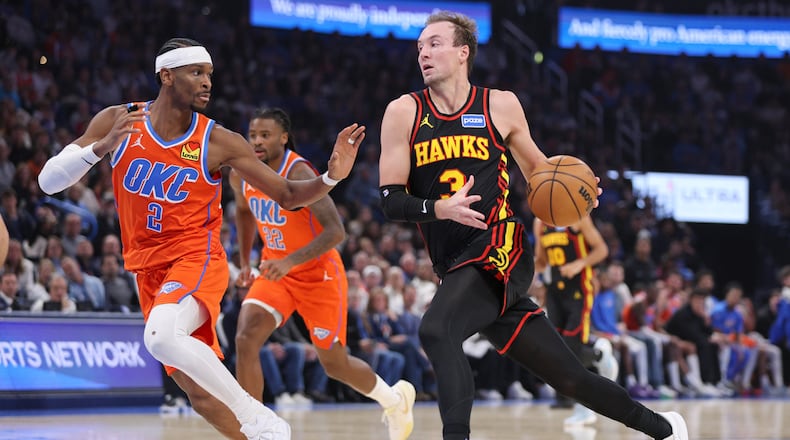 Atlanta Hawks guard Luke Kennard (3) drives against Oklahoma City Thunder guard Shai Gilgeous-Alexander (2) during the first half of an NBA basketball game Monday, Dec. 29, 2025, in Oklahoma City. (AP Photo/Nate Billings)