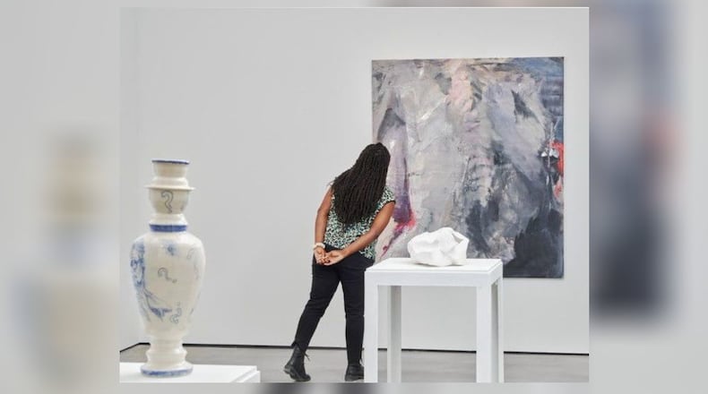 A visitor views some of the work in the exhibit "Waking Up" at The Contemporary Dayton. PHOTO BY JAKE HOLLER