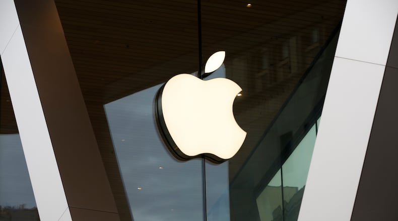 FILE - An Apple logo adorns the facade of the downtown Brooklyn Apple store on March 14, 2020, in New York. (AP Photo/Kathy Willens, File)