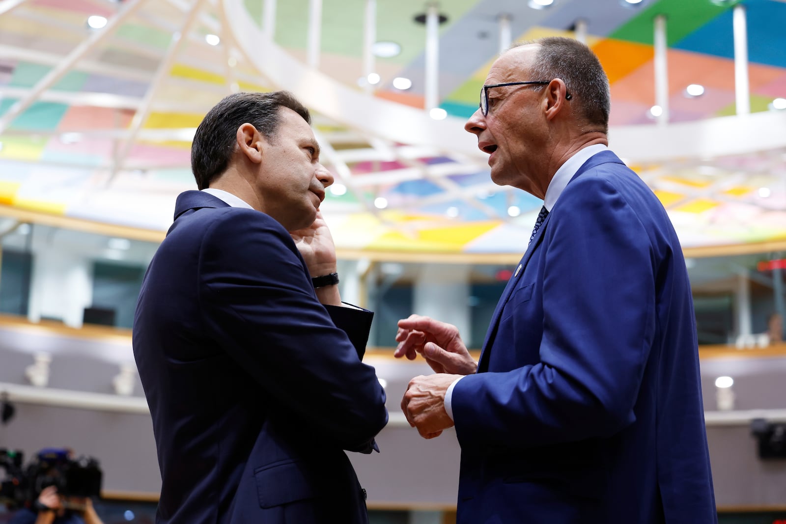 Germany's Chancellor Friedrich Merz, right, speaks with Portugal's Prime Minister Luis Montenegro during a round table meeting at an EU summit in Brussels, Thursday, June 26, 2025. (AP Photo/Geert Vanden Wijngaert)