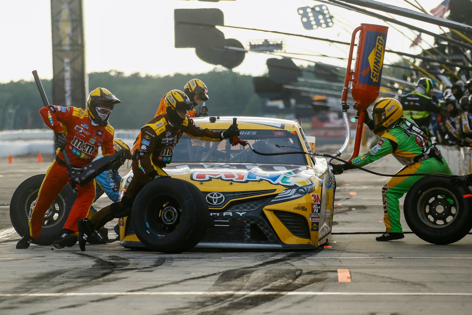 FILE - Kyle Busch makes a pit stop during the NASCAR Cup Series auto race at Pocono Raceway, June 28, 2020, in Long Pond, Pa. (AP Photo/Matt Slocum, file)