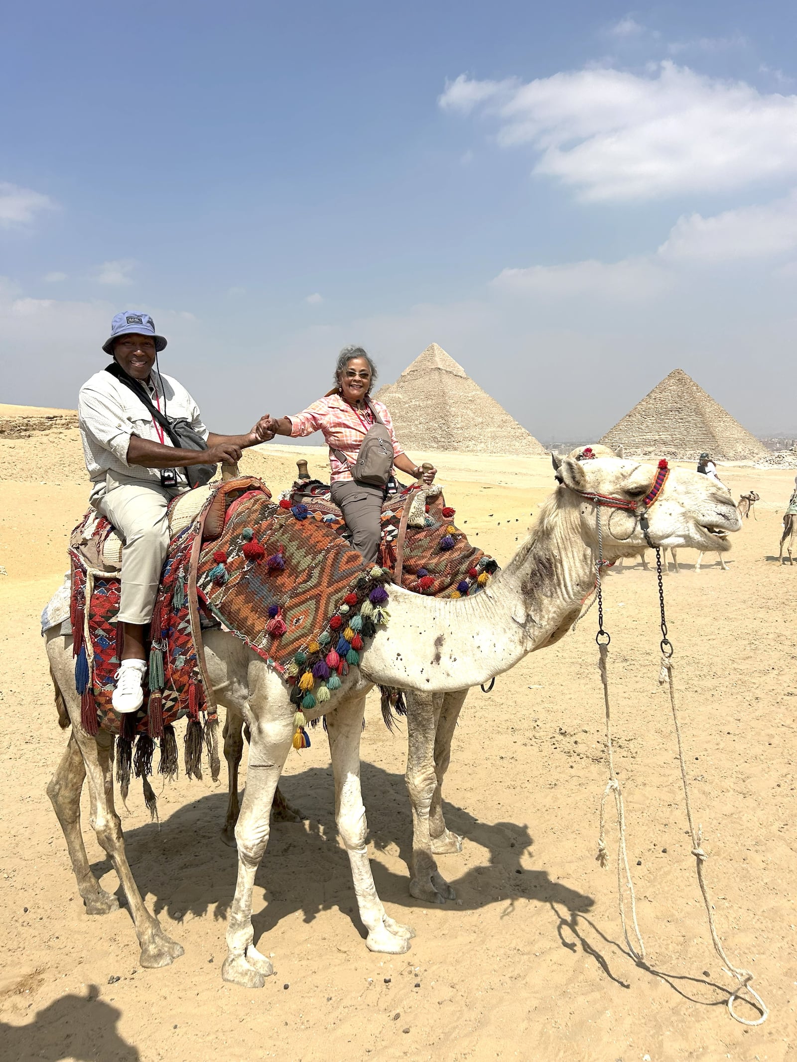 Johnny Davis and his wife Lezli aboard camels during a recent trip to the Pyramids in Giza, Egypt. CONTRIBUTED PHOTO