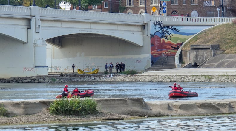 Dayton firefighters and police responded to the Great Miami River near the West Monument Avenue bridge for a report of a body in the water on Monday, Sept. 15, 2025. BRYANT BILLING / STAFF