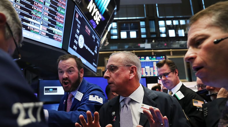 NEW YORK, NY - NOVEMBER 09: Traders work on the floor of the New York Stock Exchange (NYSE) the morning after Donald Trump won a major upset in the presidential election on November 9, 2016 in New York City. Global markets originally dropped after Trump began to pull ahead of his rival Hillary Clinton. In morning trading The Dow was down slightly. (Photo by Spencer Platt/Getty Images)