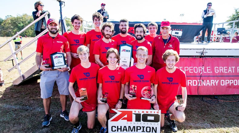 The Dayton cross country team poses with the Atlantic 10 championship trophy on Saturday in Richmond, Va. Submitted photo