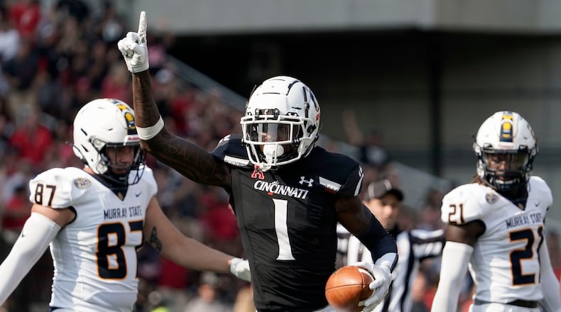 Cincinnati cornerback Ahmad Gardner (1) reacts after intercepting a ball thrown by Murray State quarterback Preston Rice during the first half of an NCAA college football game, Sept. 11, 2021, in Cincinnati. (AP Photo/Jeff Dean)