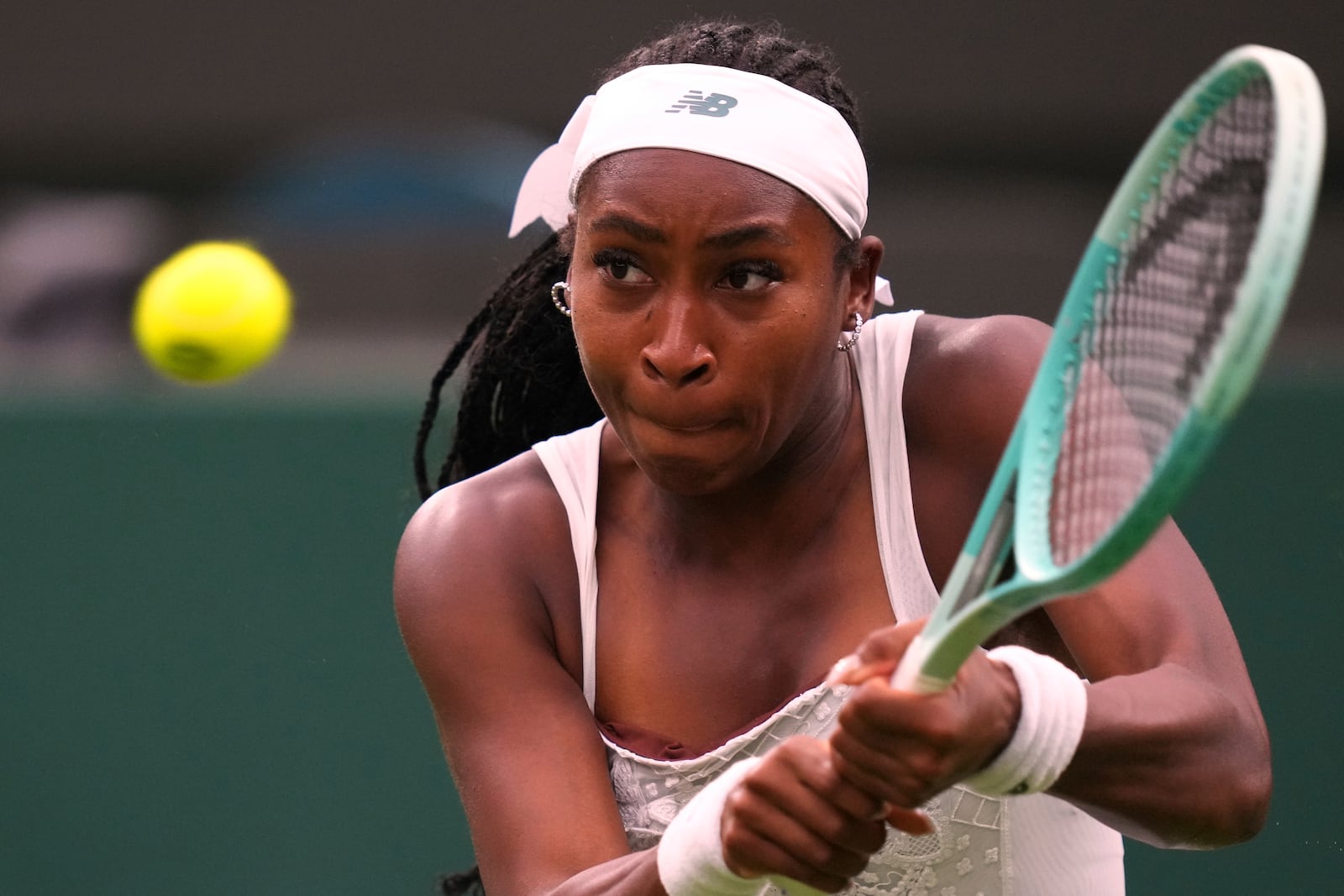 Coco Gauff of the U.S. returns the ball to Dayana Yastremska of Ukraine during their first round women's single match at the Wimbledon Tennis Championships in London, Tuesday, July 1, 2025.(AP Photo/Kirsty Wigglesworth)