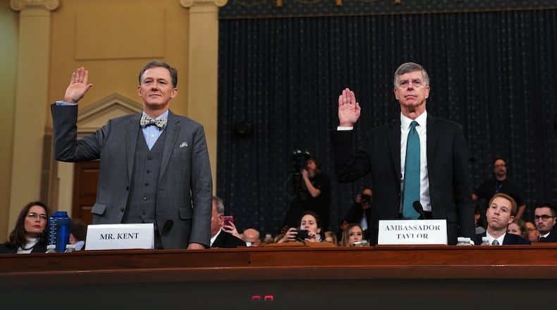 From left, George Kent, a senior State Department official in charge of Ukraine policy, and William Taylor, the top U.S. diplomat in Ukraine, are sworn in before the House Intelligence Committee in Washington on Wednesday, Nov. 13, 2019. Lawmakers are considering whether to impeach President Donald Trump for what Democrats say was an effort to use the power of his office for political gain. (Erin Schaff/The New York Times)