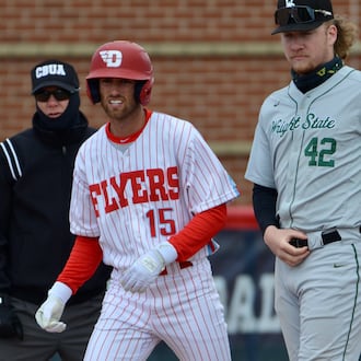 Dayton's Jake Silverstein, left, leads off in front of Wright State first baseman Drew Fleming on Tuesday, April 19, 2022, at Woerner Field in Dayton. Photo courtesy of UD