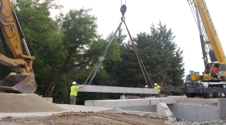 Road crews work on the Perry Road Bridge in Miami County. Contributed