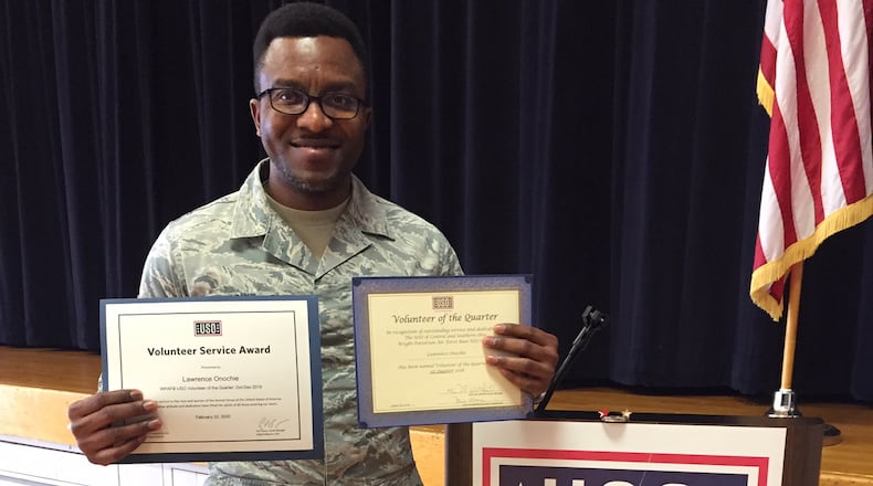 Senior Airman Lawrence Onochie, a biomedical equipment repair technician at the 88th Medical Group, Wright-Patterson Air Force Base, shows two certificates he’s been given for his two years of devoted service as a USO volunteer on base. Onochie has been selected as one of seven USO Volunteers of the Quarter for the first quarter of 2020 worldwide. (Skywrighter photo/Amy Rollins)