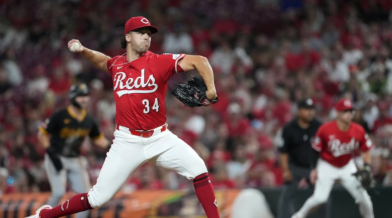 Cincinnati Reds' Connor Phillips delivers a pitch in the sixth inning of a baseball game against the Pittsburgh Pirates. Tuesday, Sept. 23, 2025, in Cincinnati. (AP Photo/Kareem Elgazzar)