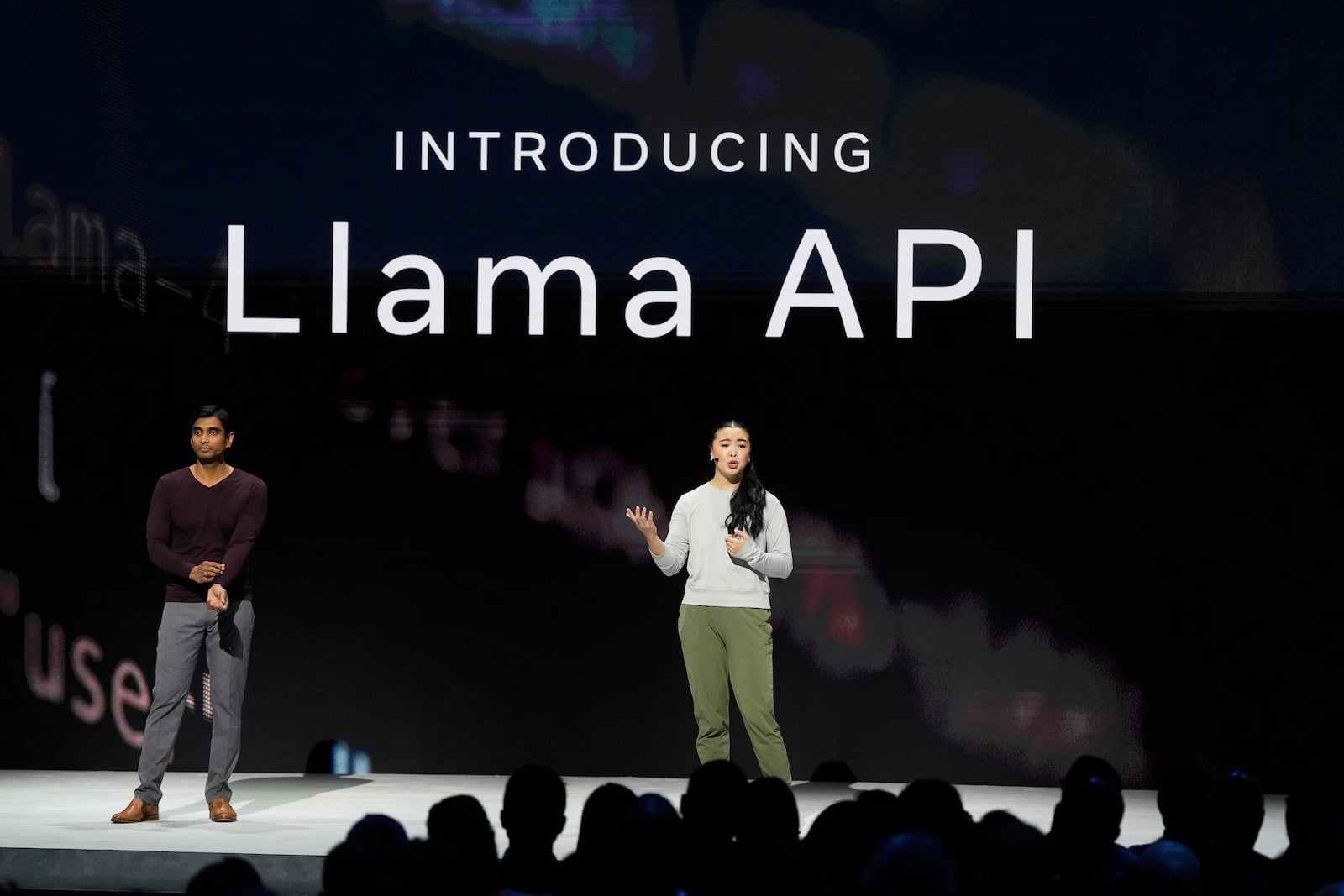 Meta Research Scientist in Generative AI, Angela Fan, right, and Meta Vice President of AI, Manohar Paluri, speak at LlamaCon 2025, an AI developer conference, in Menlo Park, Calif., Tuesday, April 29, 2025. (AP Photo/Jeff Chiu)