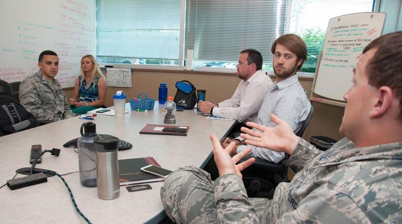 First Lt. Connor Wiese (right), a development engineer with Team Wright-Patt, proposes an idea to his team during a brainstorming session Aug. 2 as part of the Air Force Research Laboratory Commander’s Challenge 2017. The challenge brings Airmen together from a wide-range of specialties to tackle a real-world problem with a maximum budget of $50,000 and six months to develop a working demonstration. (U.S. Air Force photo/John Harrington)
