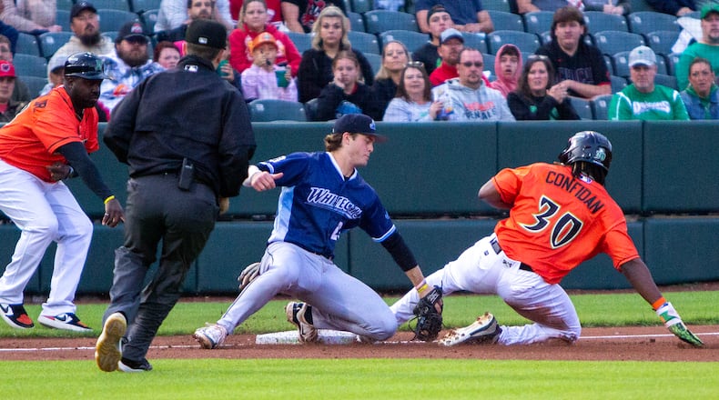 Dayton's Yerlin Confidan advances to third base on a fly ball to right field in the fourth inning Friday night at Day Air Ballpark. Jeff Gilbert/CONTRIBUTED