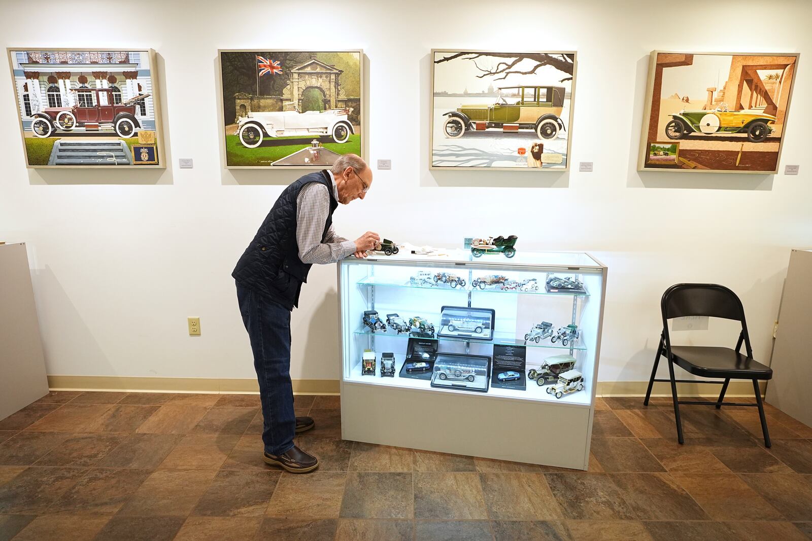 Mike Caltrider repairs a model part of the automobilia collection at The Rolls-Royce Foundation in Mechanicsburg, Pa., Saturday, April 5, 2025. (AP Photo/Matt Rourke)