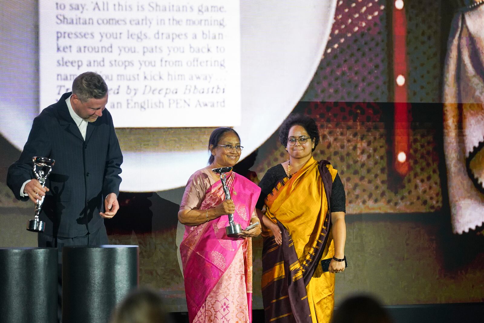 Banu Mushtaq, author of 'Heart Lamp', left, and Deepa Bhasthi react after winning the International Booker Prize, in London, Tuesday, May 20, 2025.(AP Photo/Alberto Pezzali)