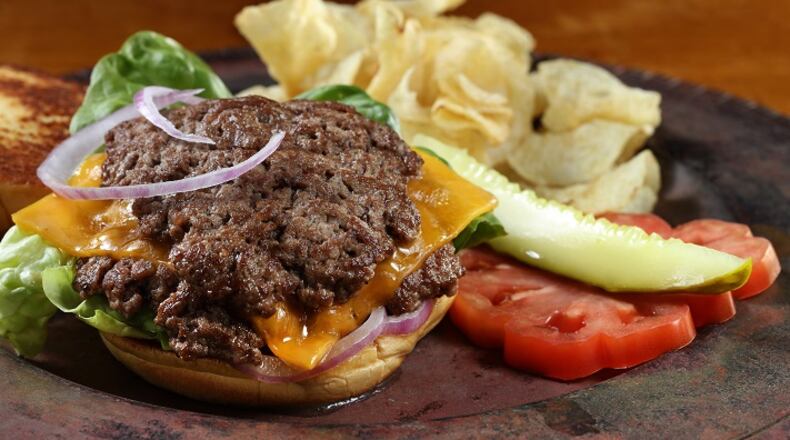 Learn the secret to keeping thin burgers juicy. (Abel Uribe/Chicago Tribune/TNS)