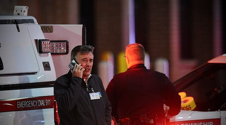 Police respond to the scene of a shooting on Monday, Nov. 20, 2023 in Beavercreek, Ohio. Police say a shooter opened fire at a Walmart, wounding four people before apparently killing himself. The attack took place Monday night at a Walmart in Beavercreek, in the Dayton metropolitan area. (Marshall Gorby/Dayton Daily News)